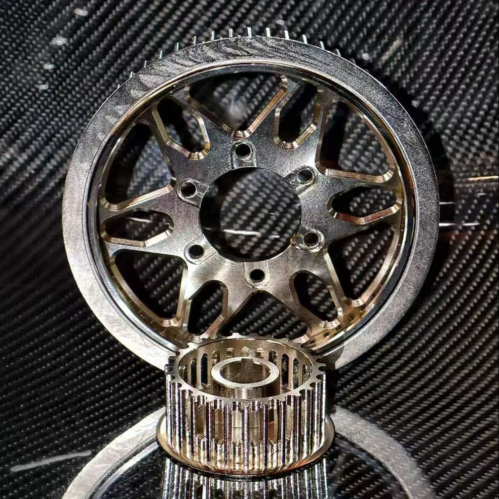 Close-up of mechanical gears on a textured black background