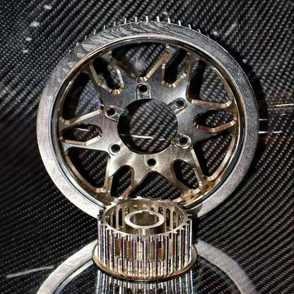 Close-up of mechanical gears on a textured black background
